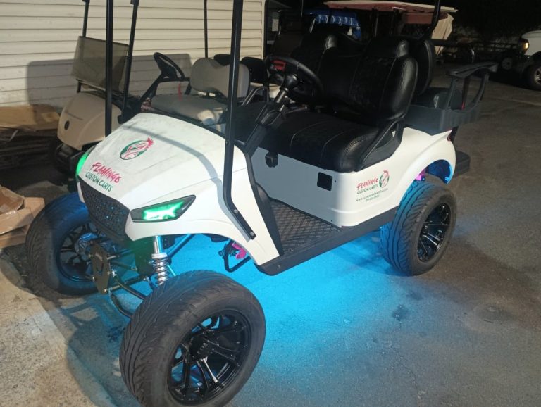 Customized golf cart with LED lights and aftermarket wheels from Flamingo Custom Carts in Atlanta.